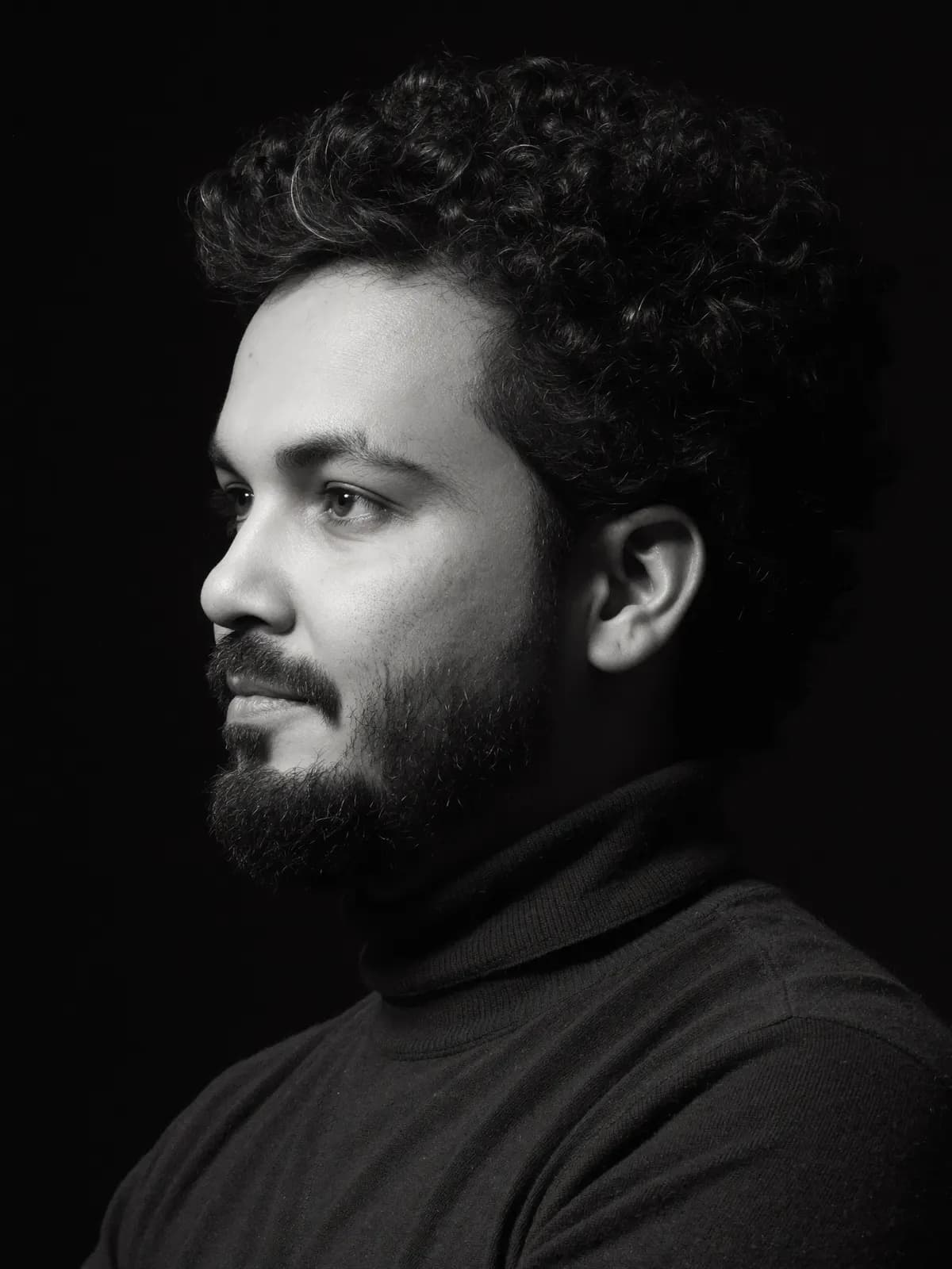 Black-and-white portrait of Sankar in profile